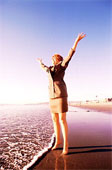 Happy business woman beach